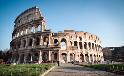 The exterior of the Colosseum in Rome, Italy, on a bright and sunny day